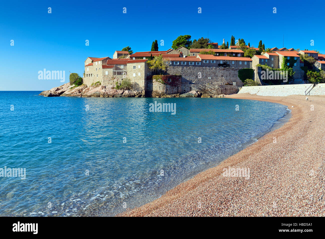 Sveti Stefan island  old  town castle,  view from beach. Montenegro, Europe Stock Photo