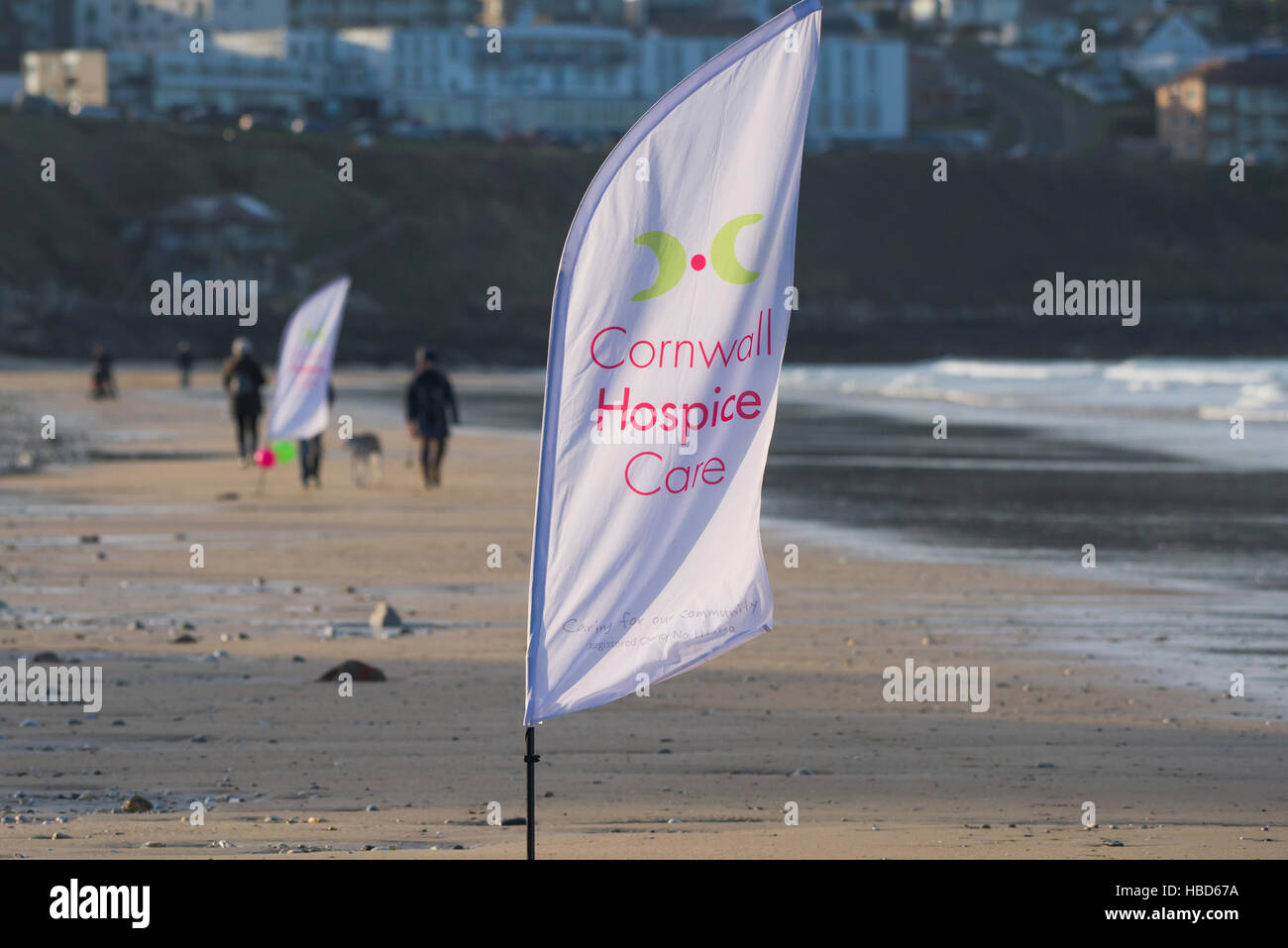 Cornwall Hospice Care charity banners on Fistral Beach in Newquay, Cornwall. Stock Photo