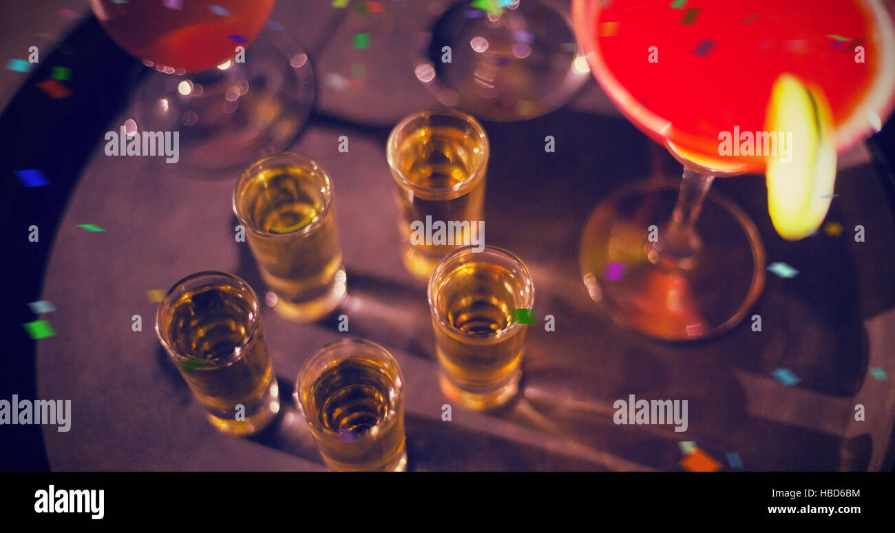 Composite image of cocktail drinks and shot glasses of tequila on serving tray Stock Photo