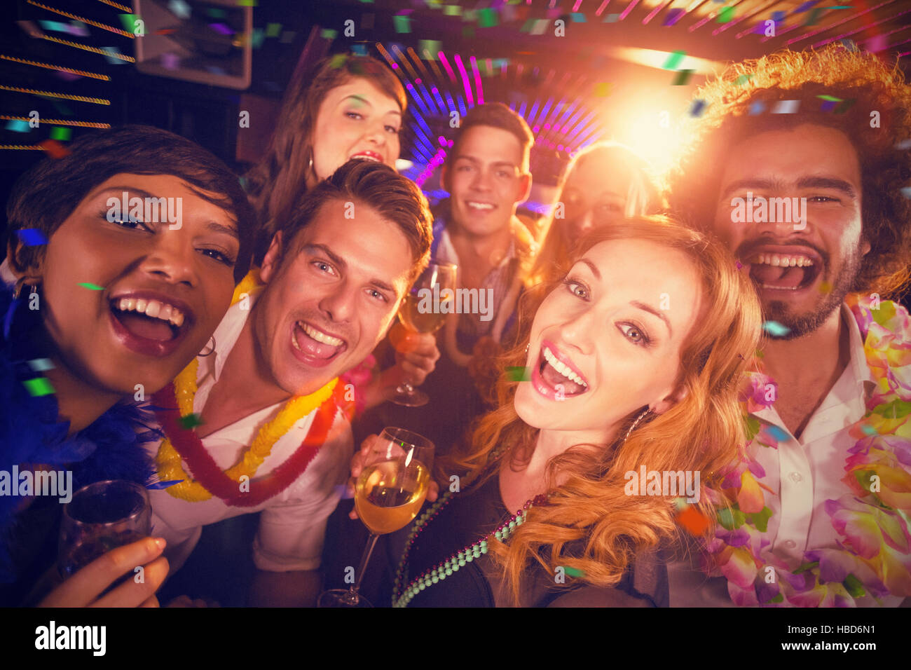 Composite image of group of friends having fun in bar Stock Photo