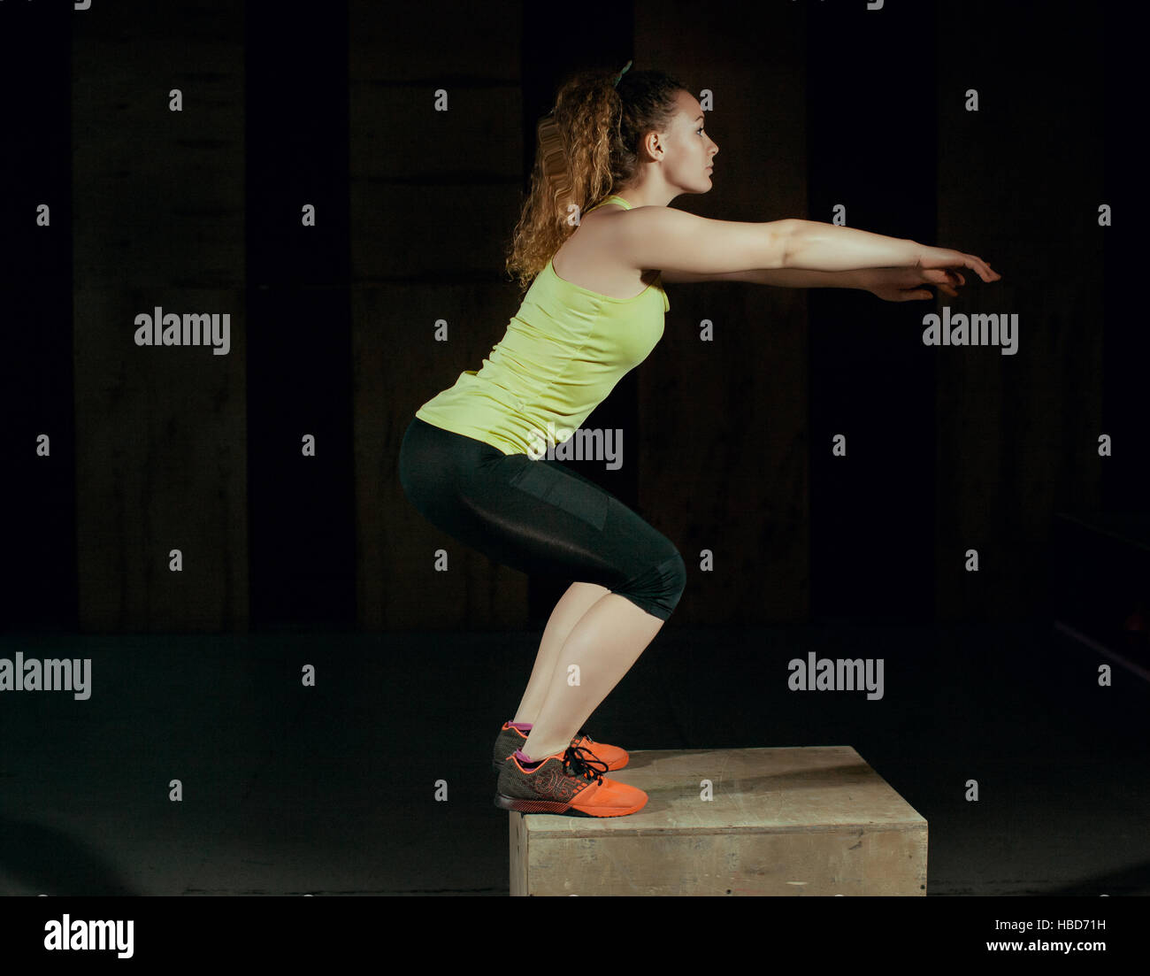 Young girl jumps on a stand in the gym Stock Photo - Alamy