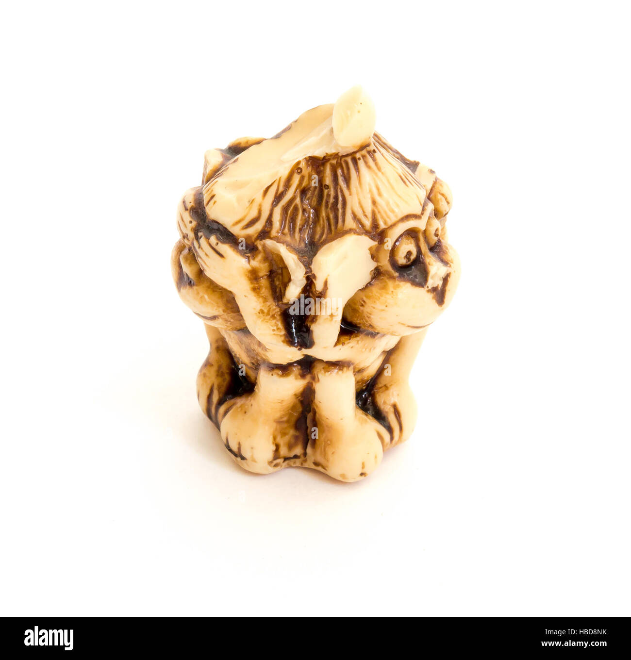 Japanese netsuke Three wise monkeys, sometimes called the three mystic apes, are a pictorial maxim. Stock Photo