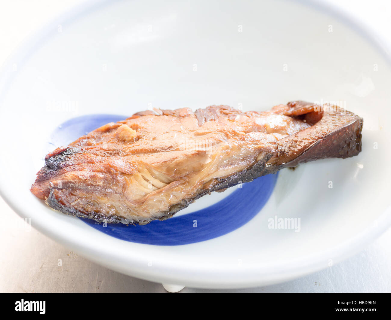 Japanese cuisine, teriyaki yellowtail fish on the table Stock Photo