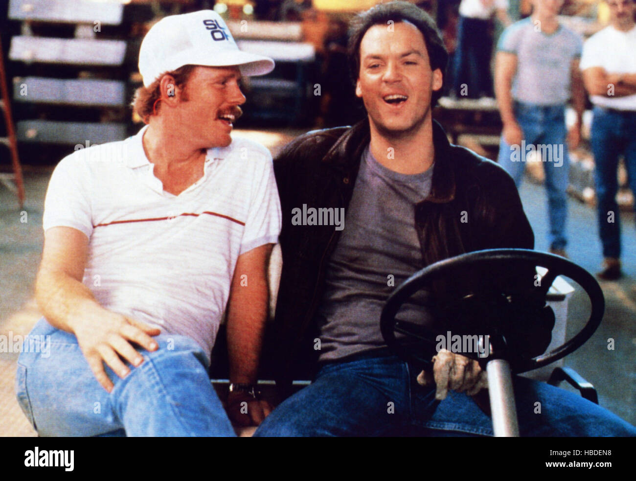 GUNG HO, from left; director Ron Howard, Michael Keaton on set, 1986