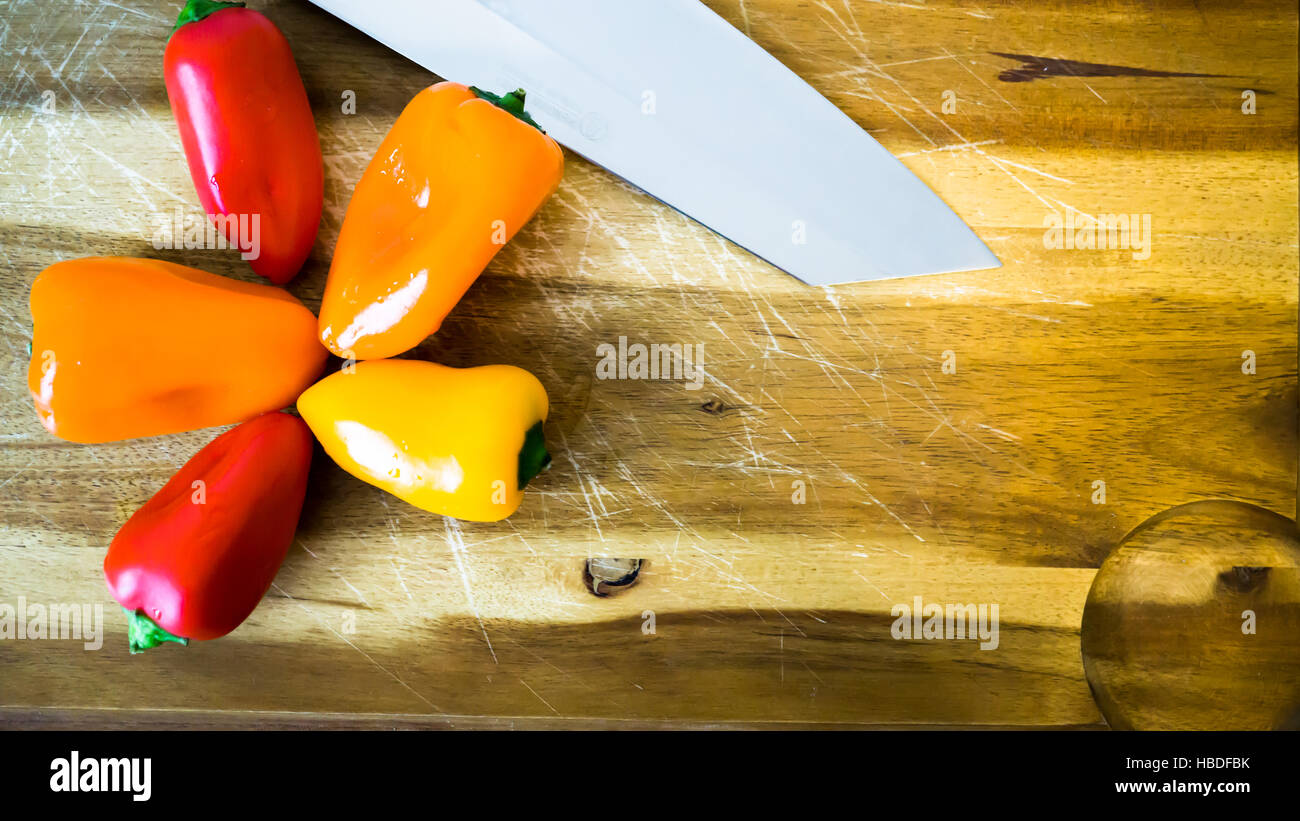 mixed paprika and knife on a cutting board Stock Photo