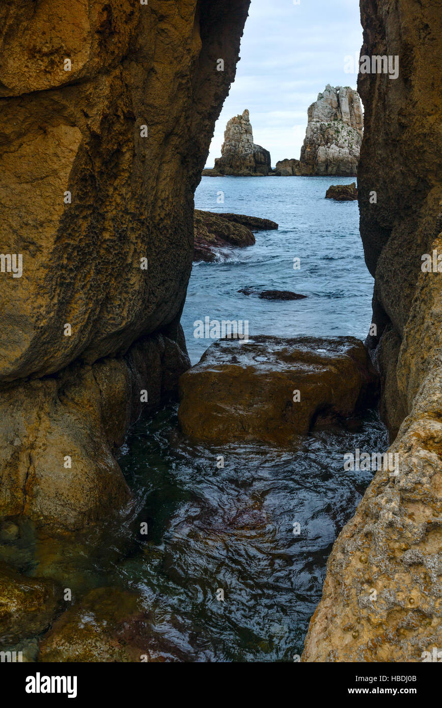 Seascape through slit in rock Stock Photo - Alamy