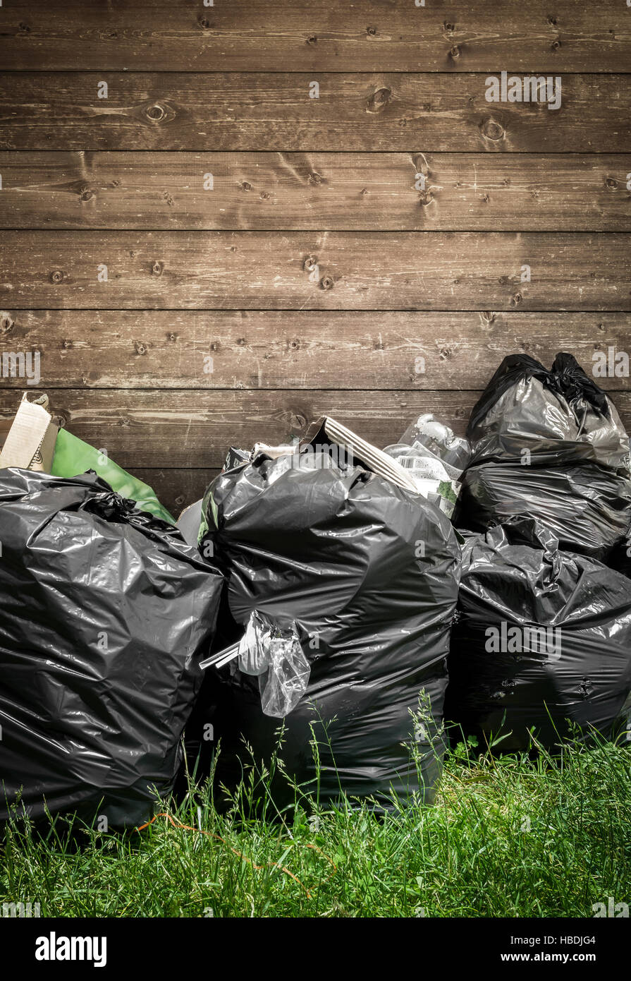 Green and black garbage bags Stock Photo by ©maurus 129875750