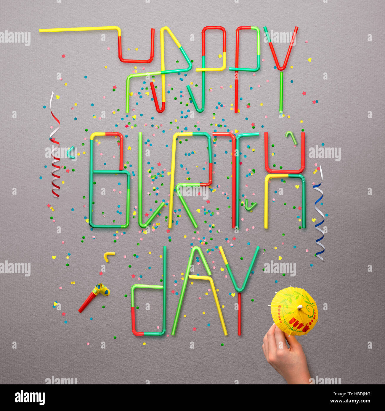 Creative Still Life Photo Of Happy Birthday Sign Made Of Cocktail Straws With Confetti And Serpentine On Grey Background Stock Photo Alamy
