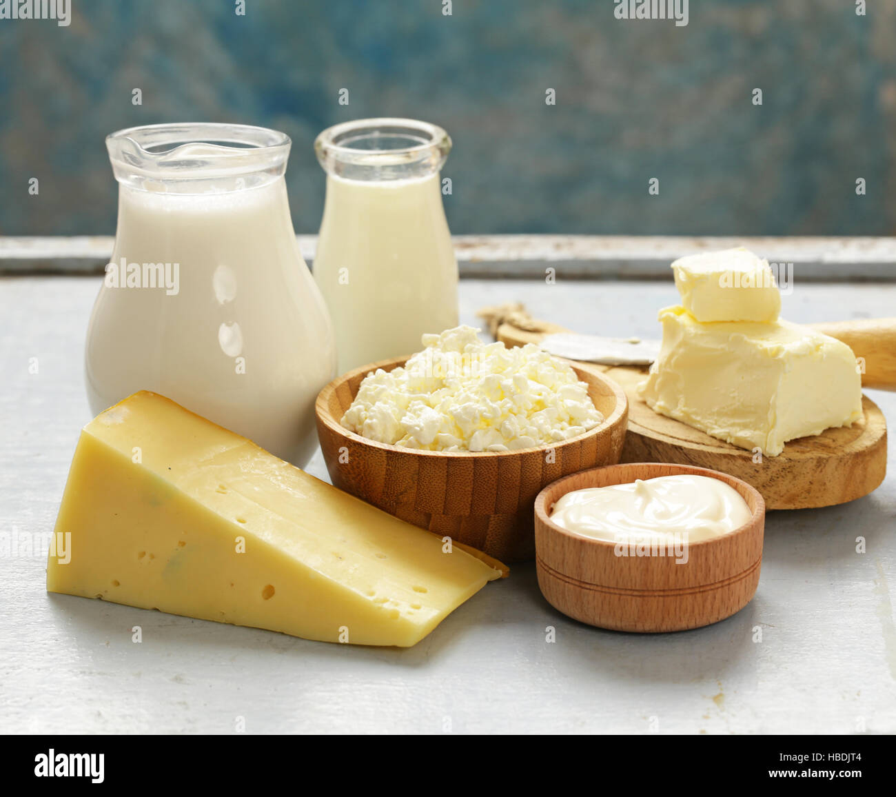 Assorted dairy products (milk, yogurt, cottage cheese, sour cream) rustic still life Stock Photo