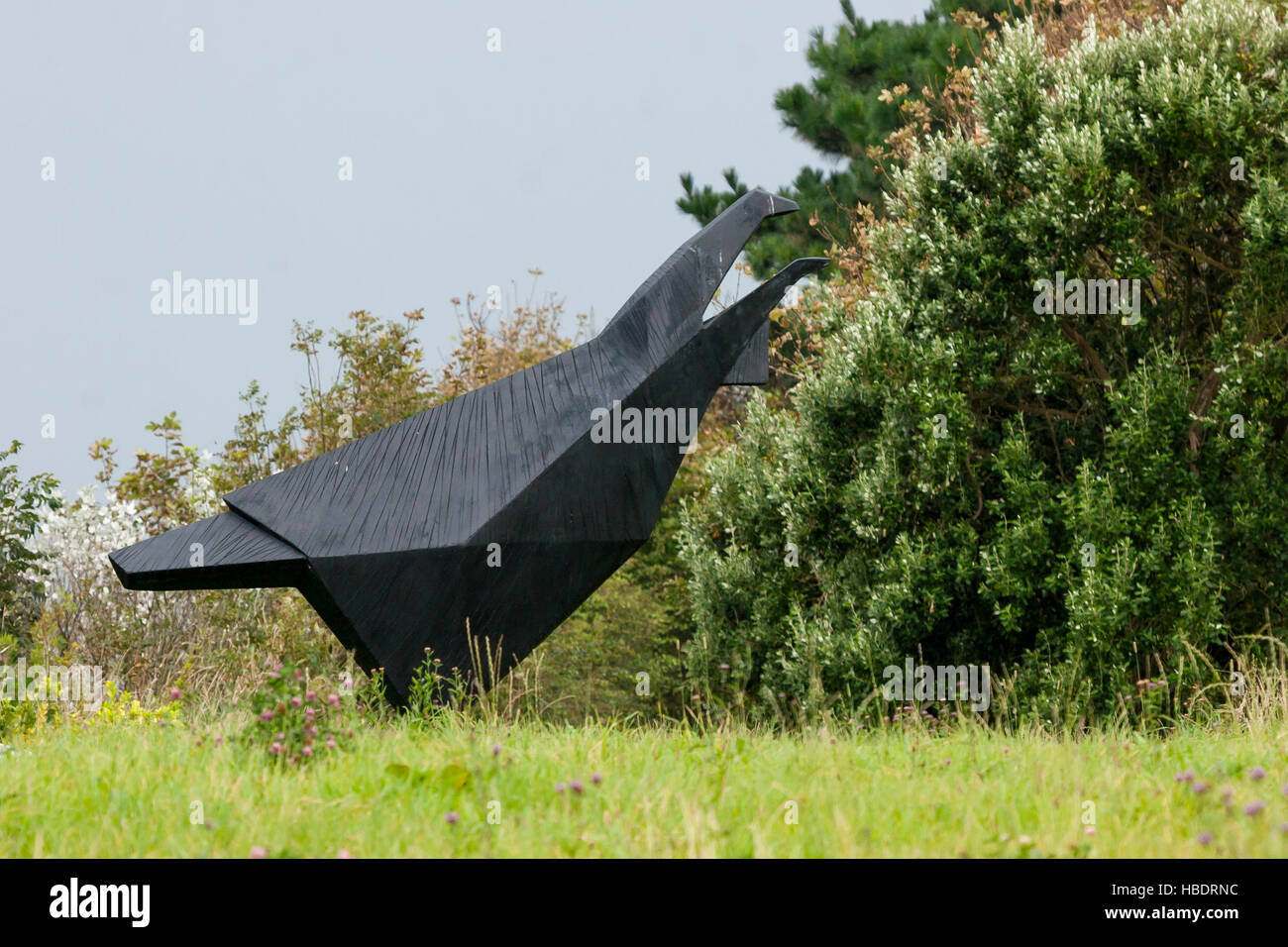 modern art outside sculpture of bird in black Stock Photo