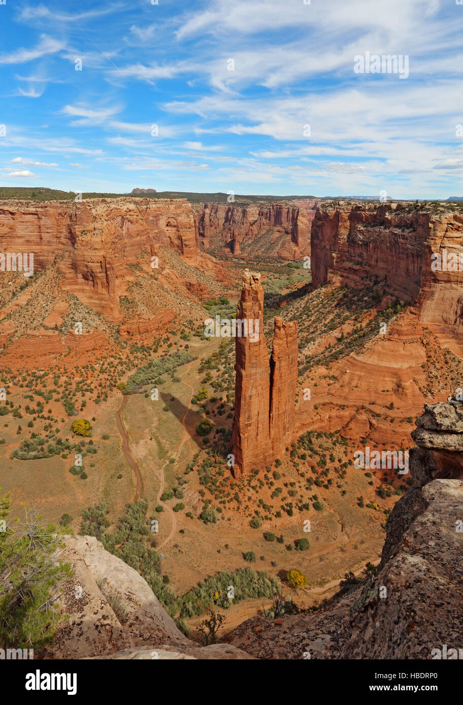 The red sandstone spire of Spider Rock at Canyon de Chelly National Monument in the Navajo Nation near Chinle, Arizona vertical Stock Photo