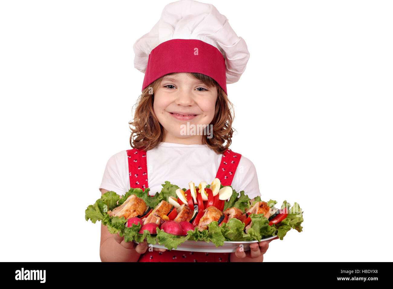 beautiful little girl cook with gourmet food Stock Photo