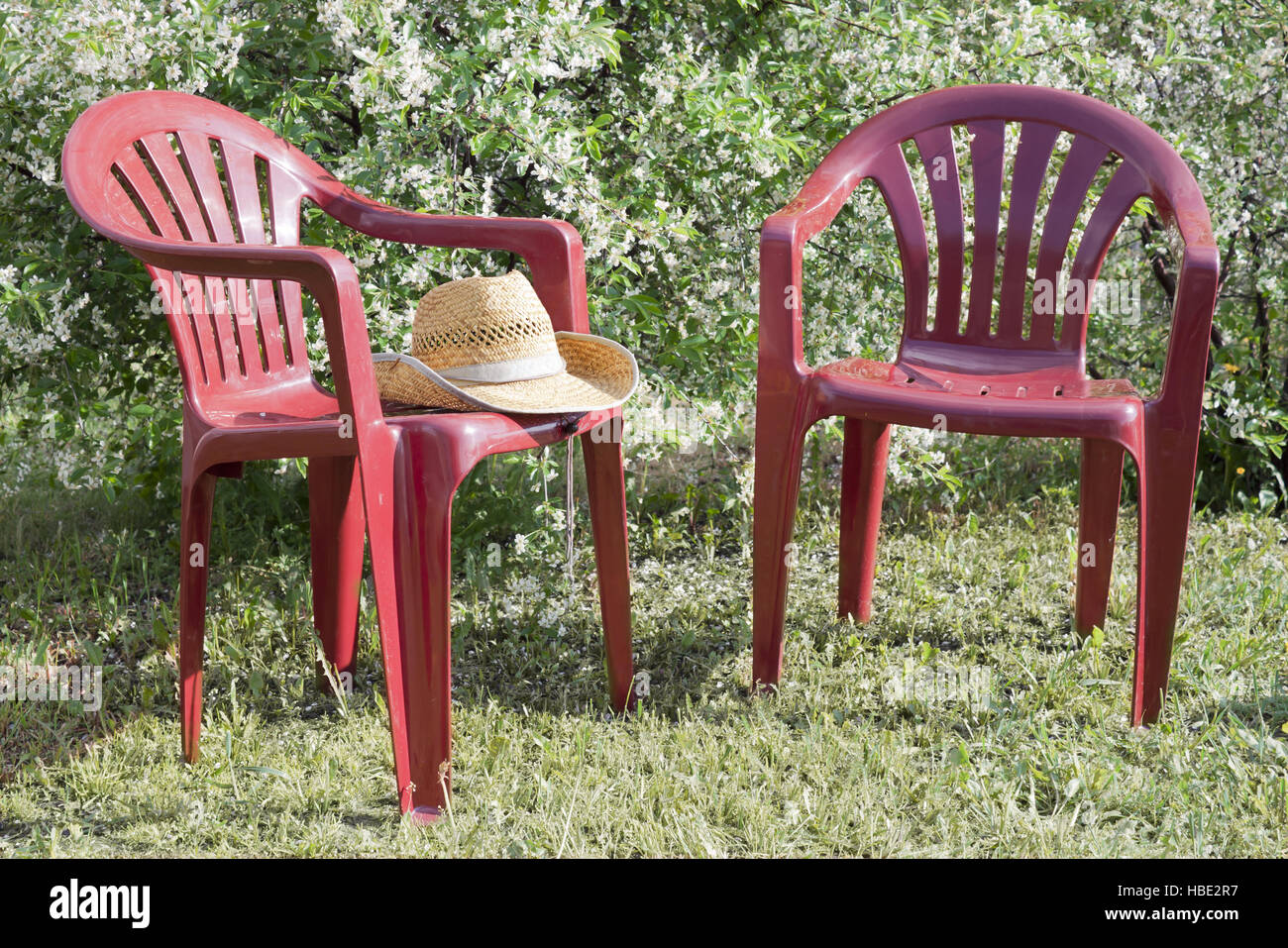Plastic chairs in the garden Stock Photo