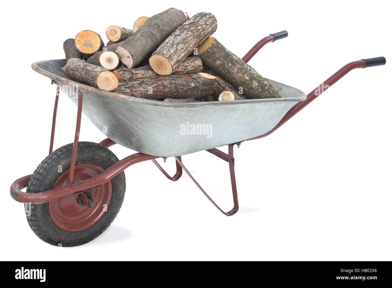 Firewood in an old wheelbarrow Stock Photo