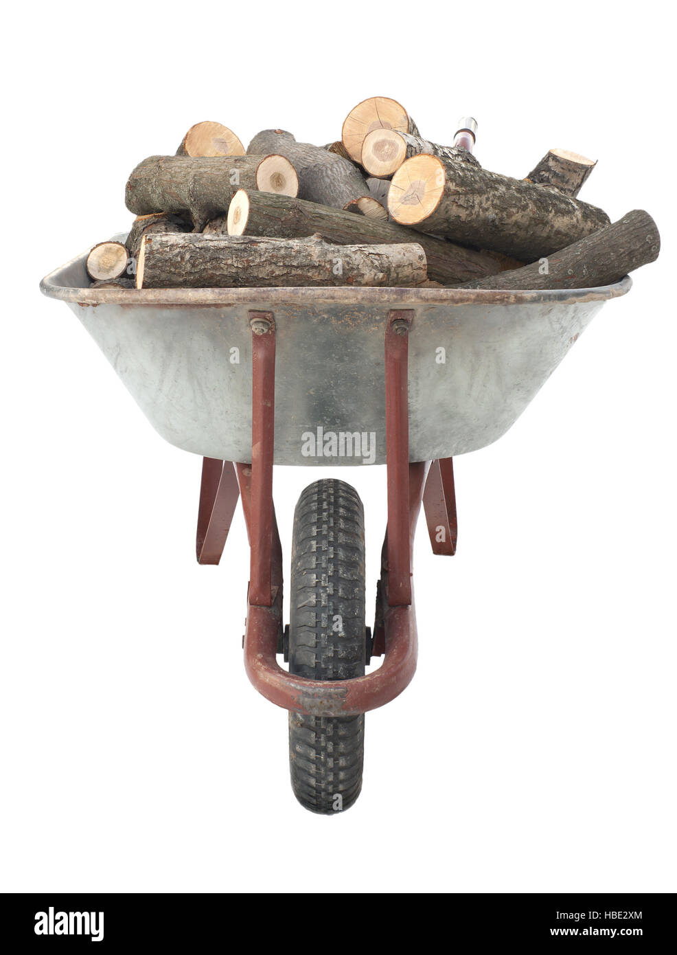 Firewood in old wheelbarrow Stock Photo