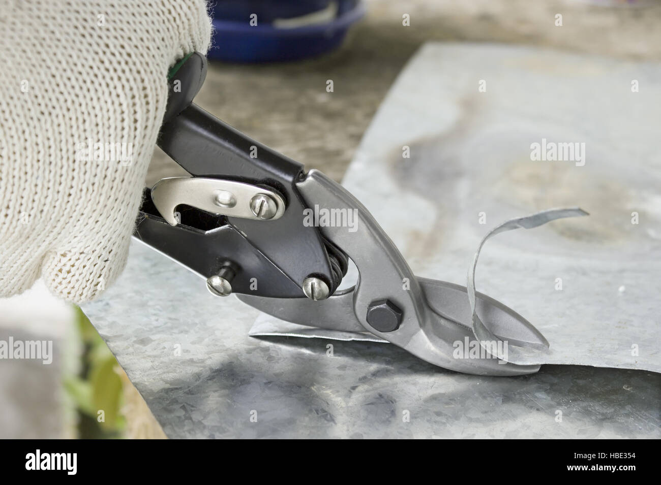 Scissors cut metal into strips Stock Photo Alamy