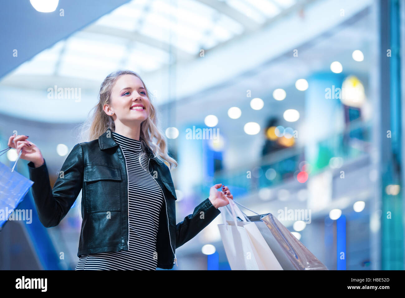 Young girl in a store Stock Photo - Alamy