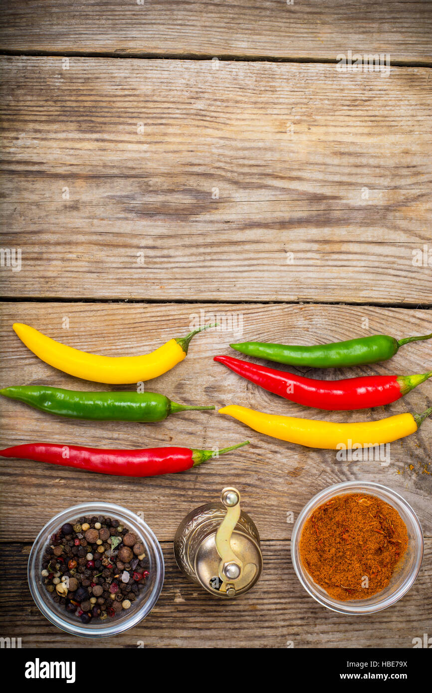Chilli peppers on wooden background Stock Photo - Alamy