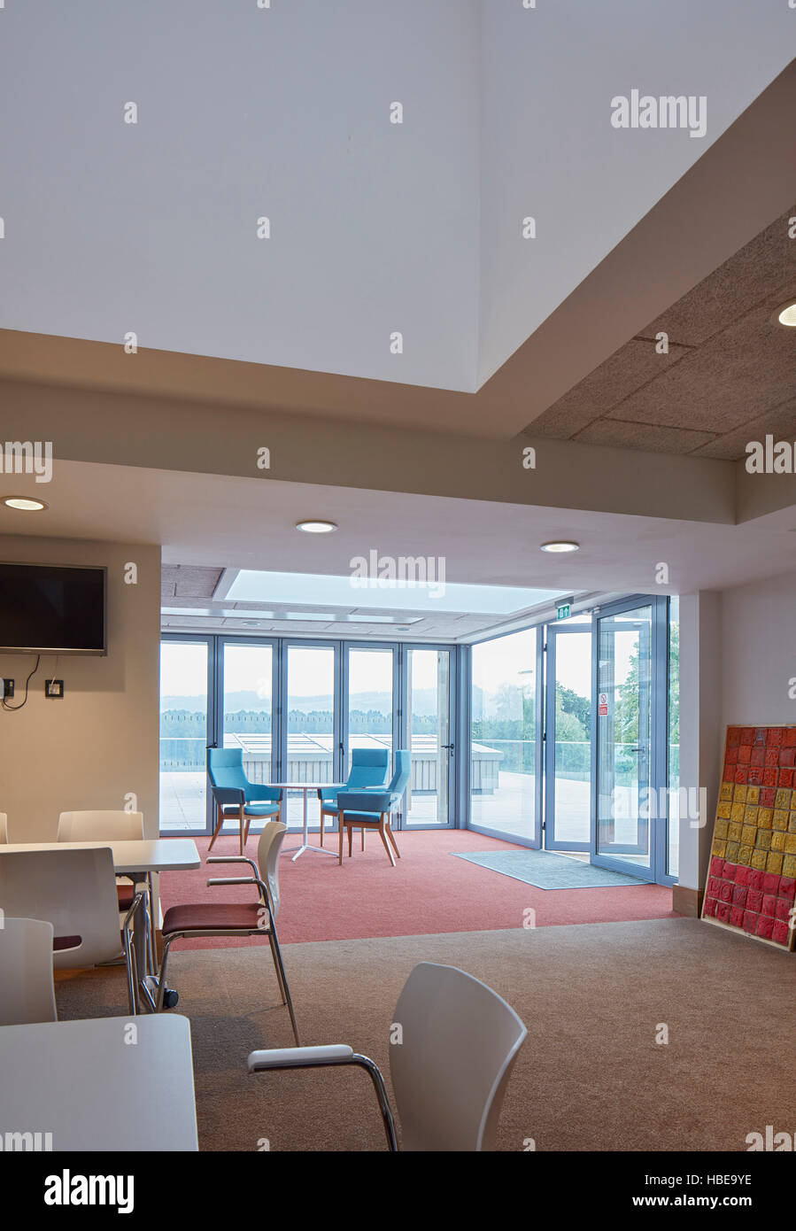 Communal sitting room with garden view. St Michael's Hospice, Hereford