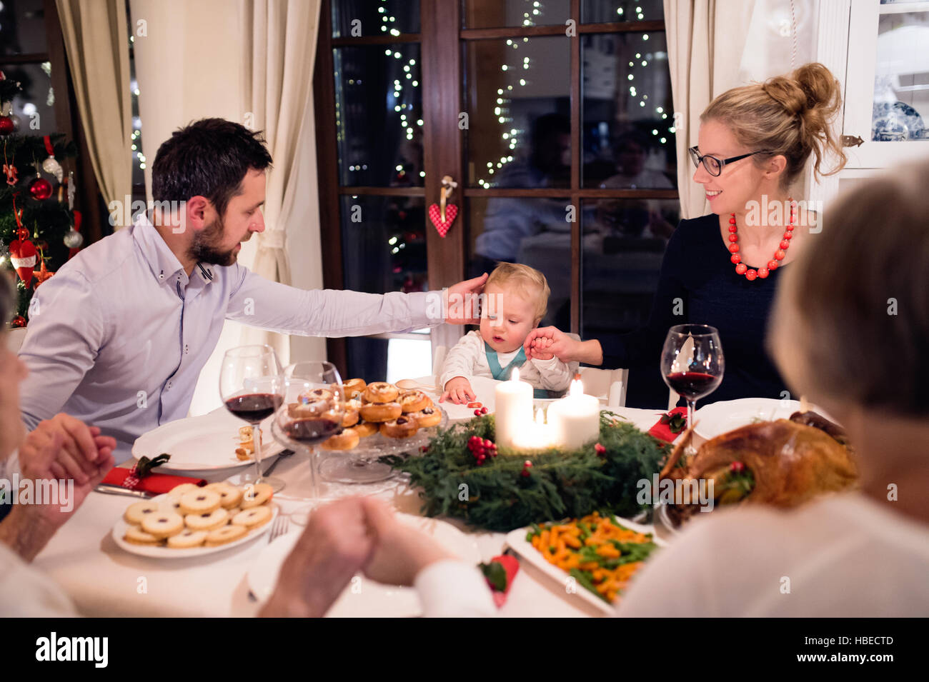 Family praying together meal dining hi-res stock photography and images ...