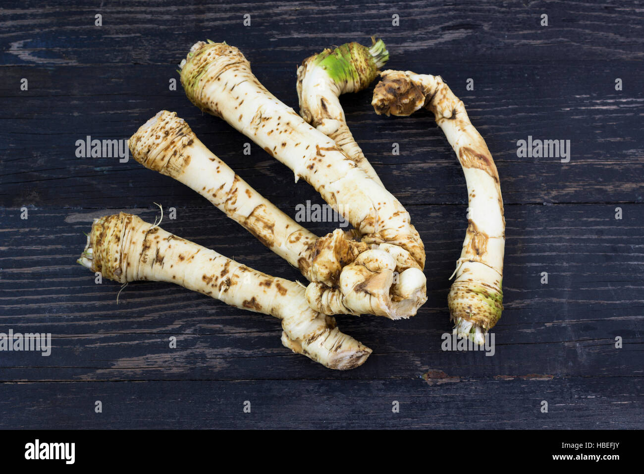 Fresh horseradish roots on wooden background Stock Photo Alamy