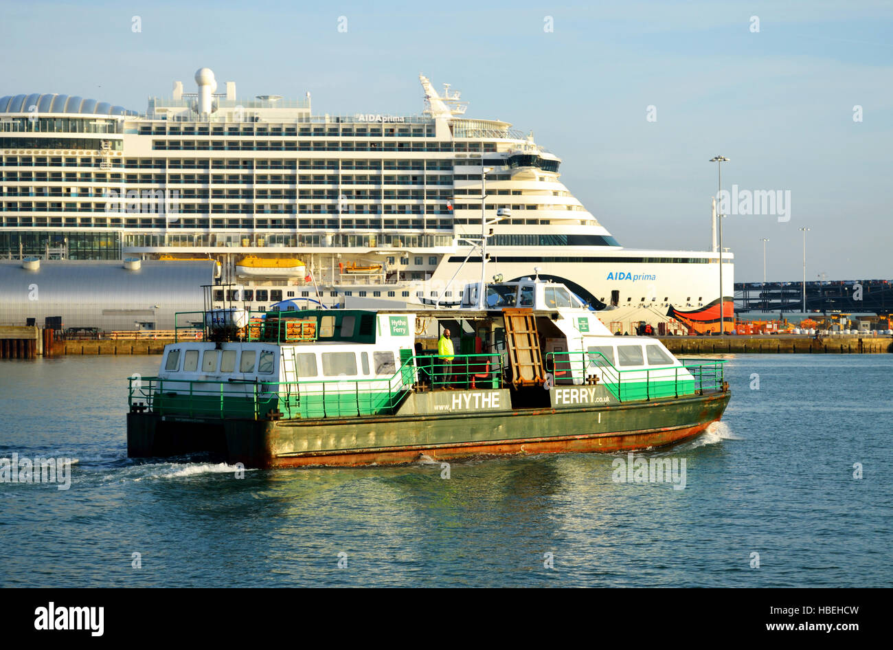 Hythe Ferry leaving Town Quay in Southampton with cruise ship AIDA prima in the background Stock Photo