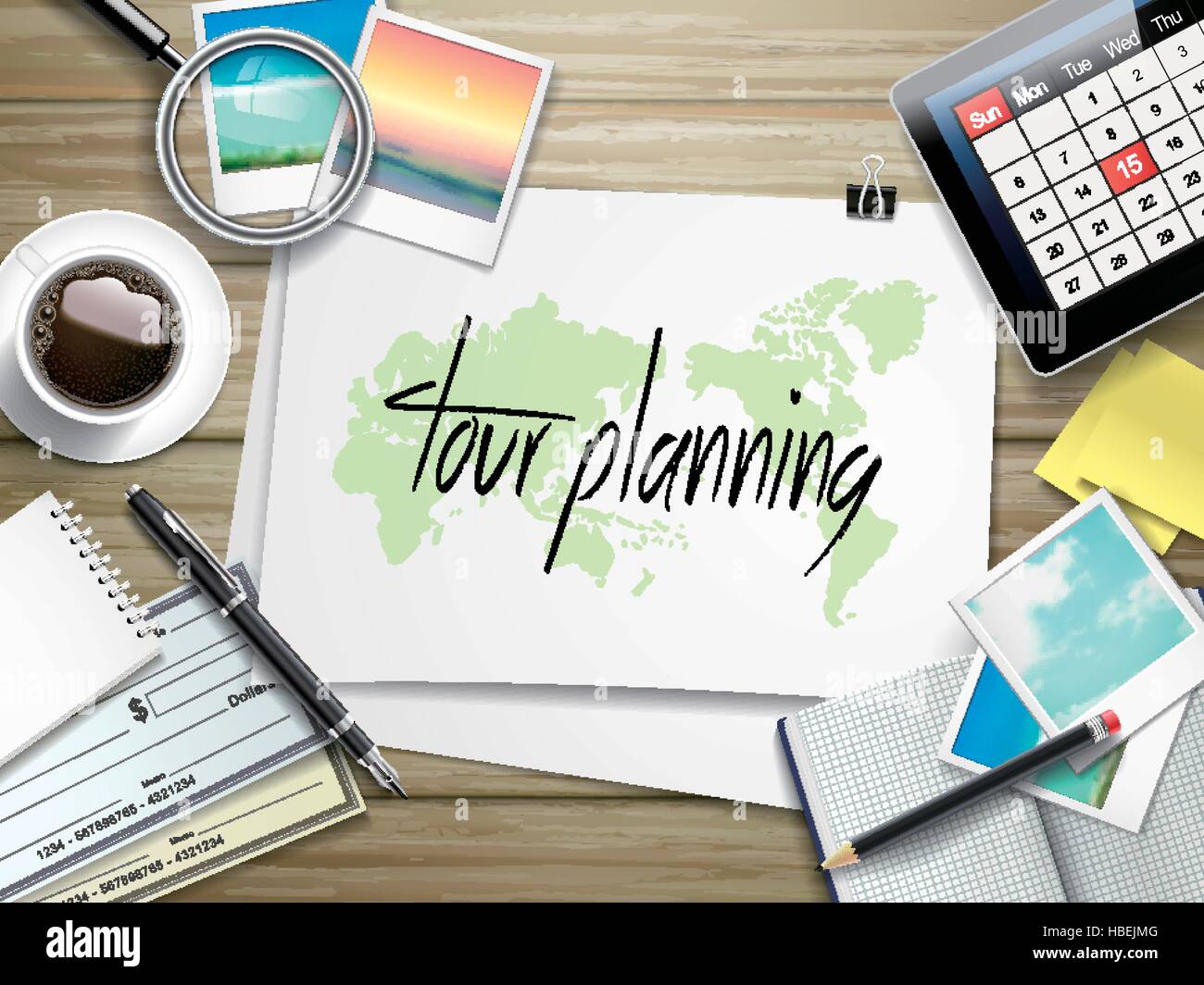 top view of travel items on wooden table with tour planning written on