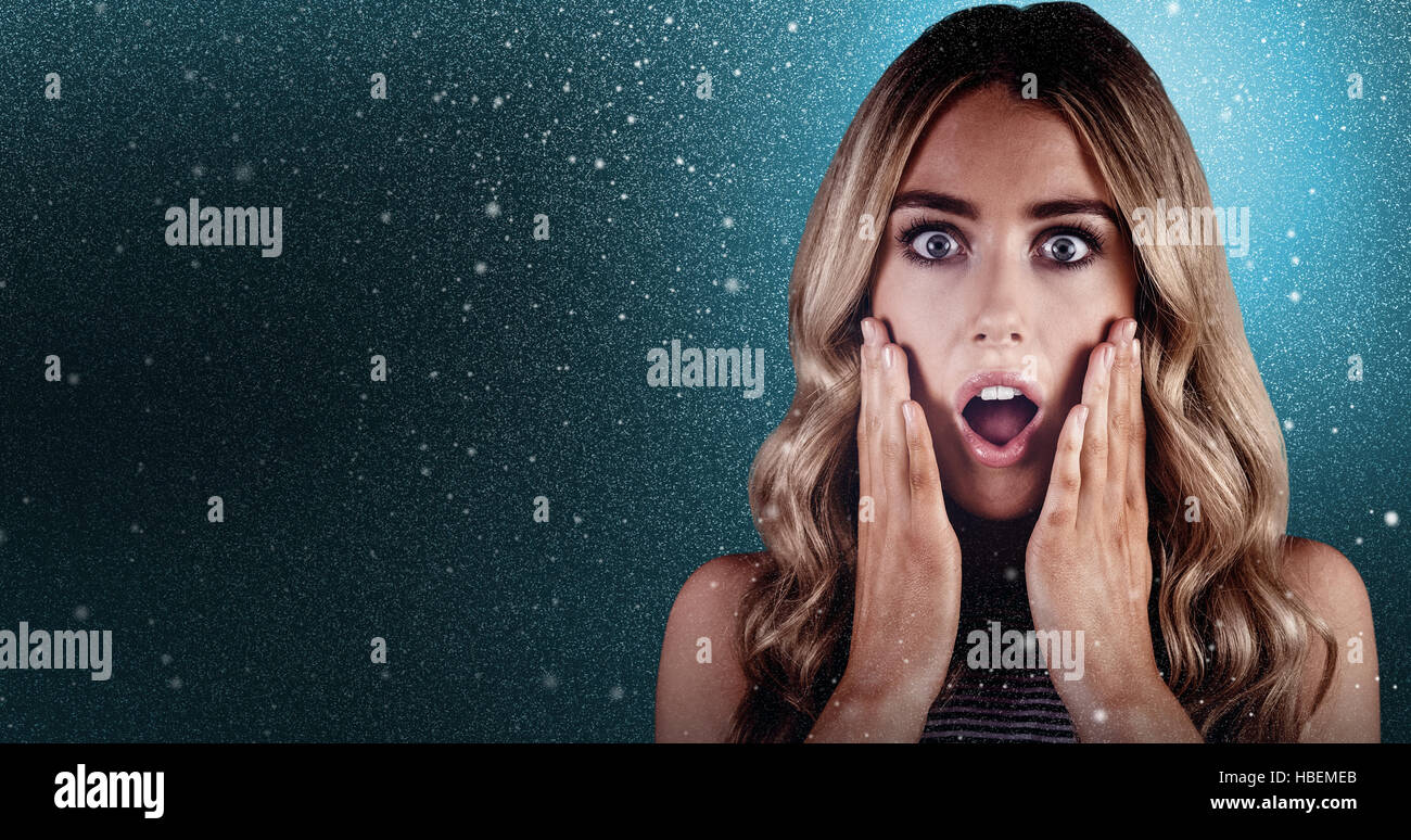Composite image of beautiful blonde woman being shocked Stock Photo