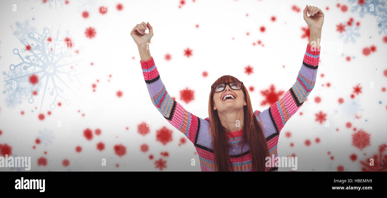 Composite image of smiling hipster woman using laptop while putting hands up Stock Photo