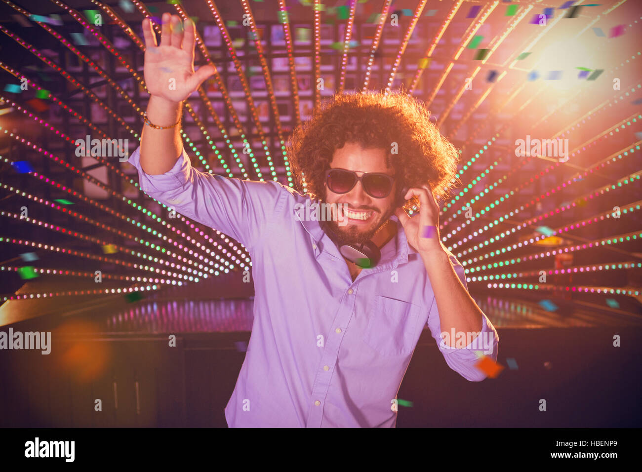 Composite image of male dj playing music Stock Photo
