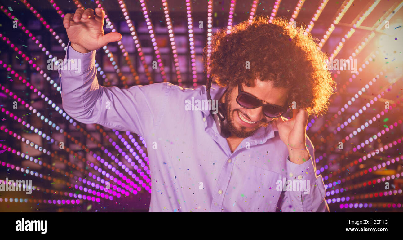 Composite image of male dj playing music Stock Photo