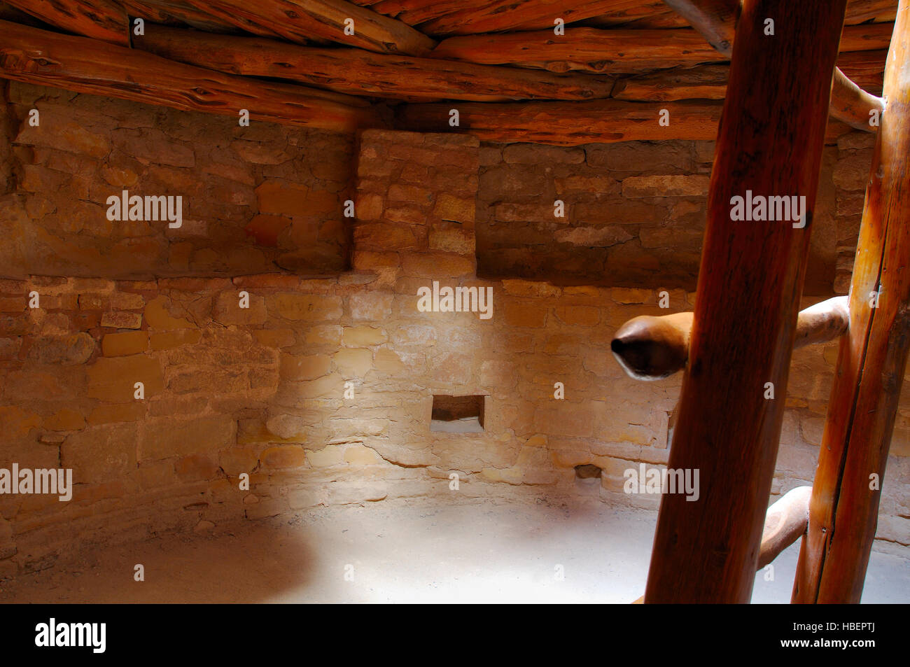 Restored Kiva C, Ladder to Entrance, Pilasters supporting Roof, Spruce Tree House Cliff Dwelling, Anasazi Hisatsinom Ancestral Pueblo Site, Chapin Mes Stock Photo