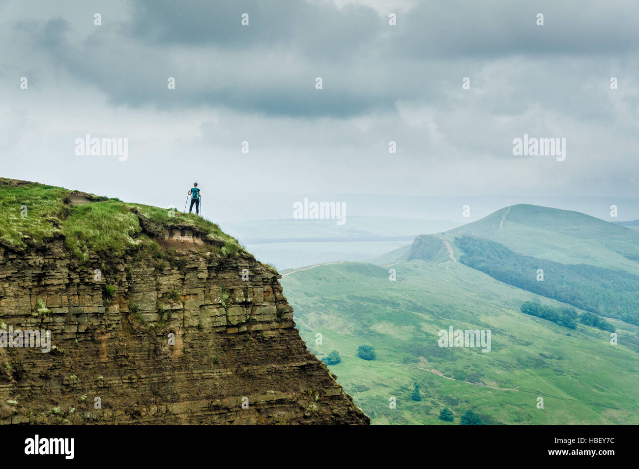 Walker on hill, Peak District, Derbyshire, UK. Stock Photo