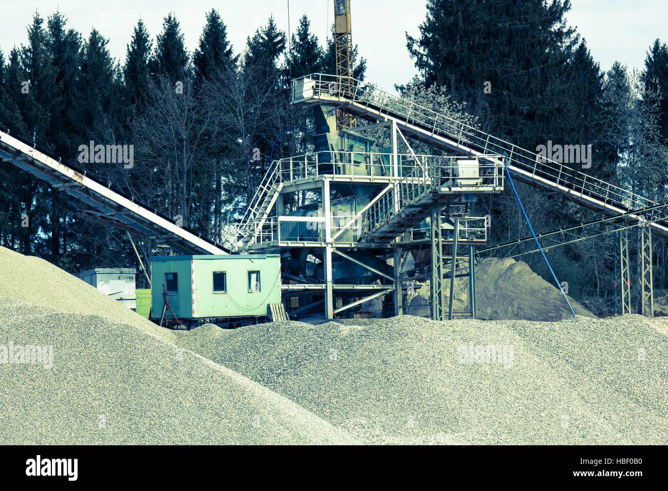 Gravel pit with cottage and conveyor belt Stock Photo