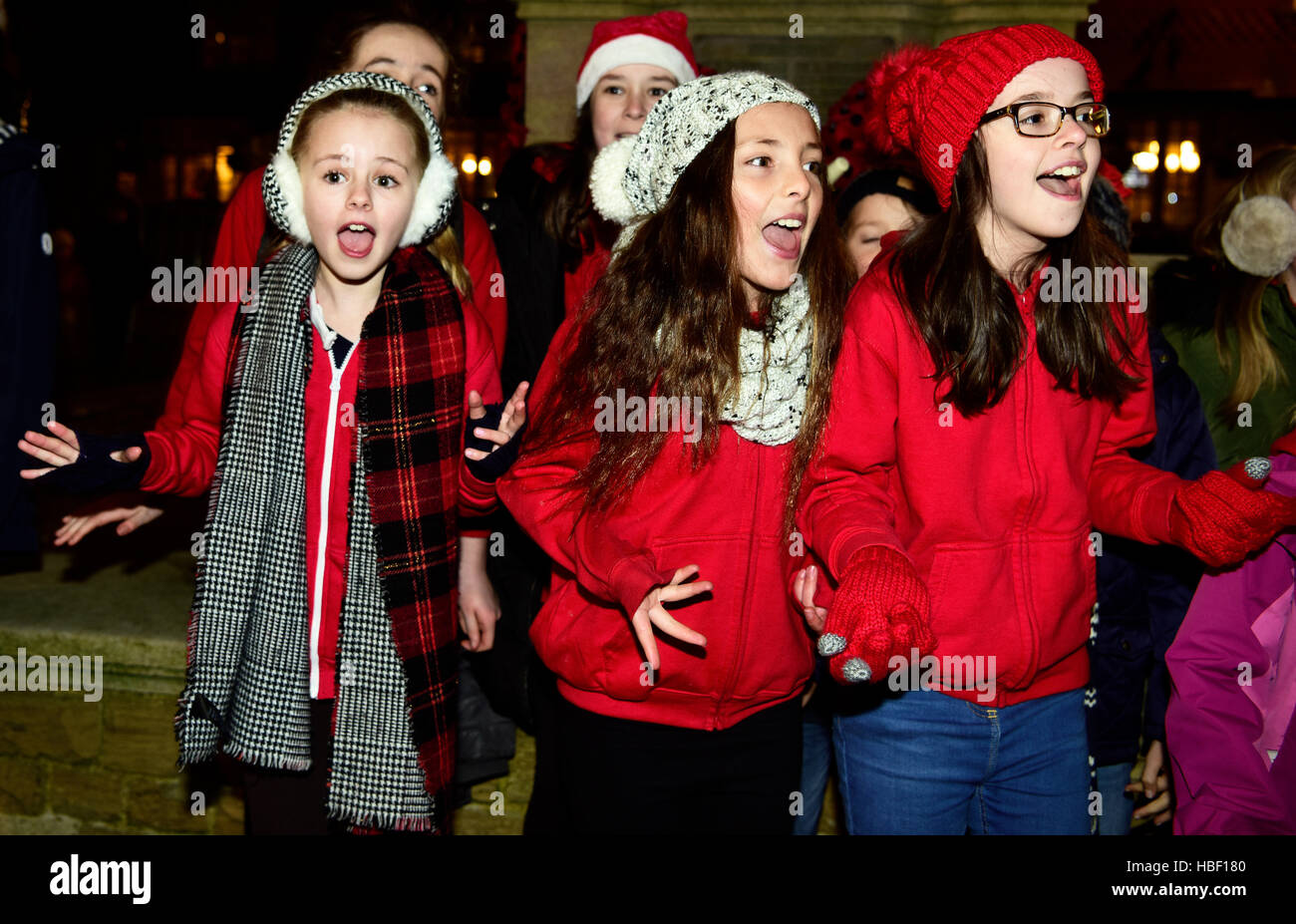 Local young thespian group performing in the High Street at the 2016 switching on of the Christmas lights, Haslemere, Surrey, UK. Stock Photo