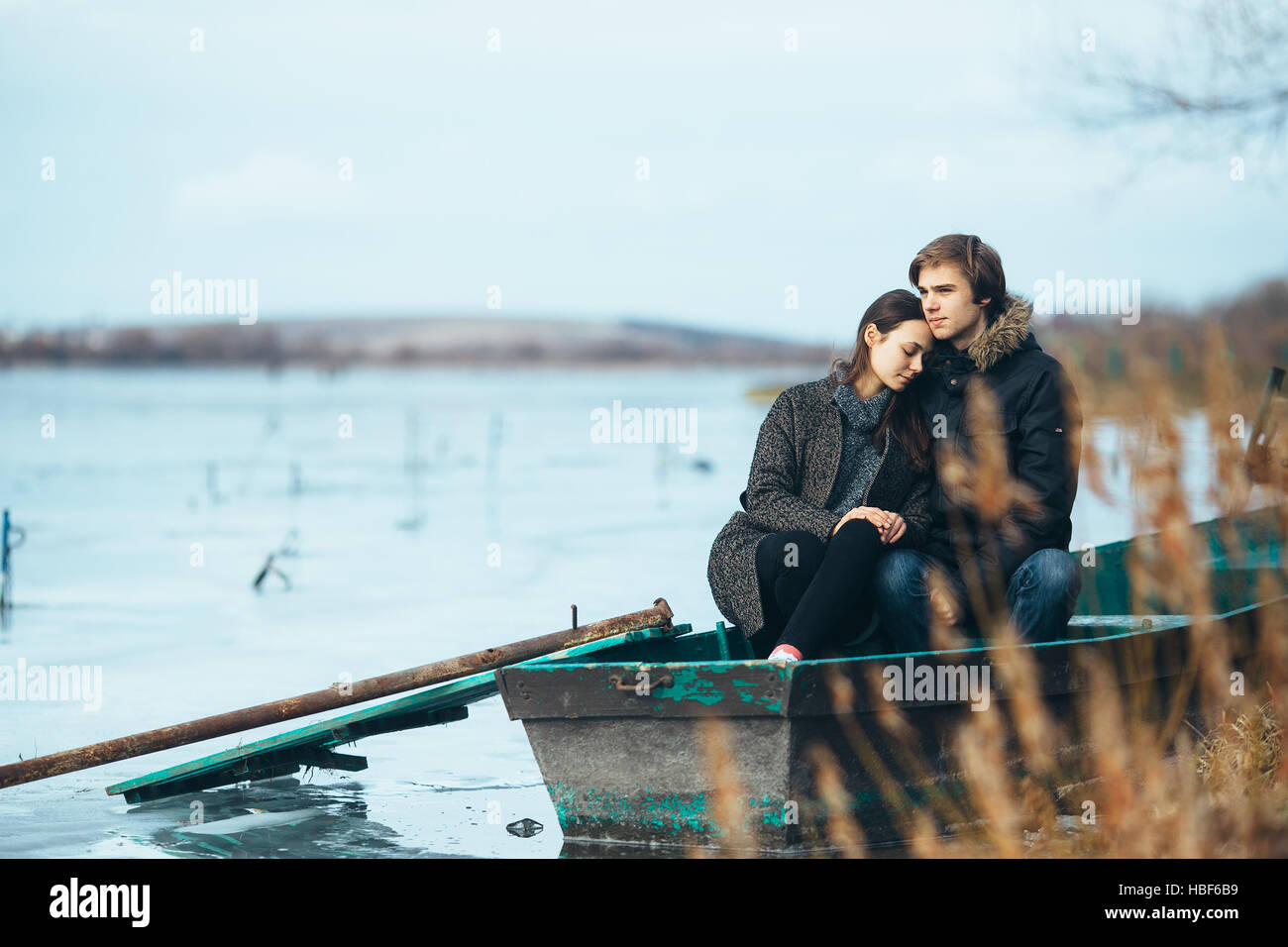 young beautiful couple on the ice of a frozen lake Stock Photo - Alamy
