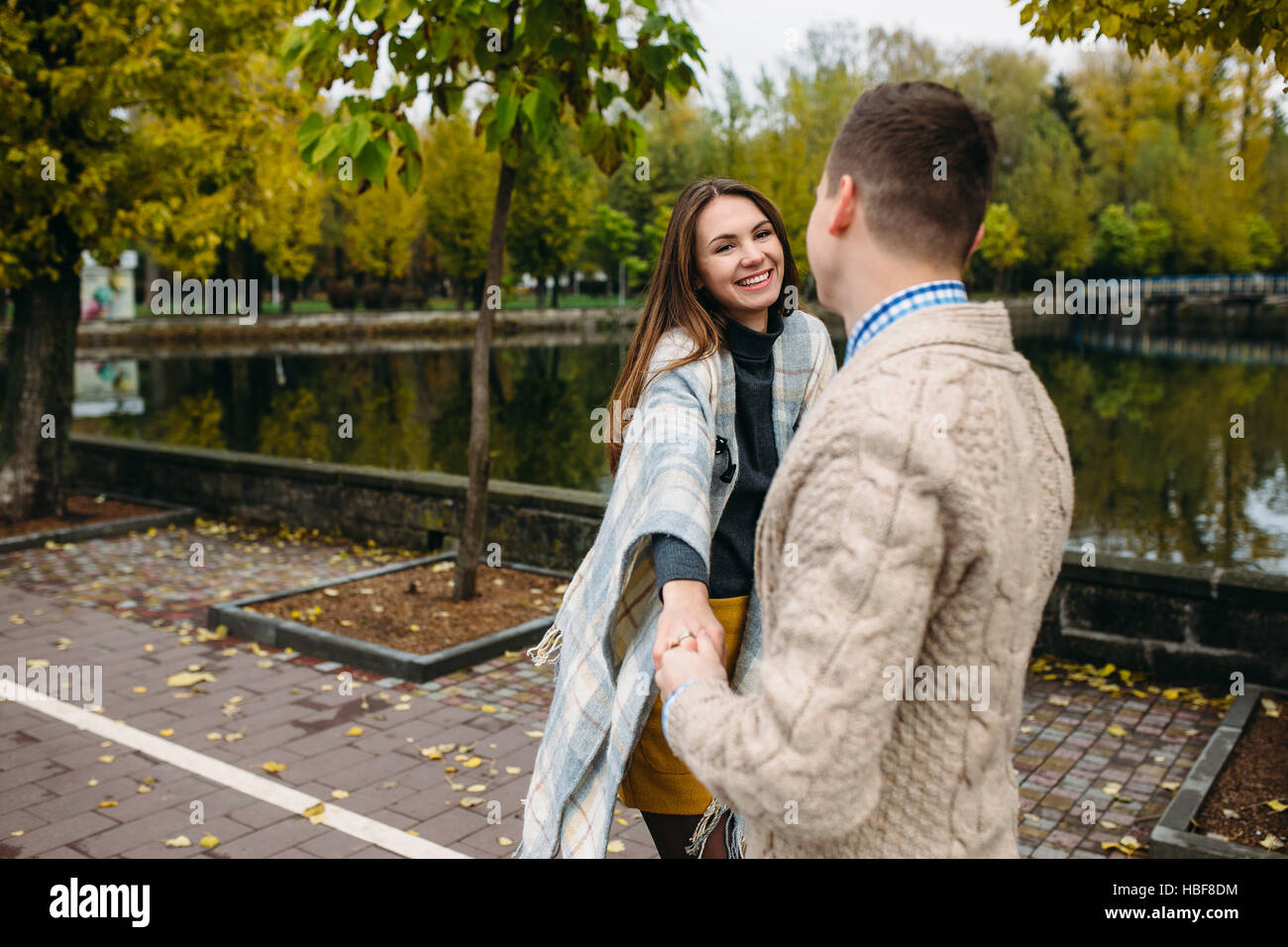 smiling couple in autumn park Stock Photo - Alamy