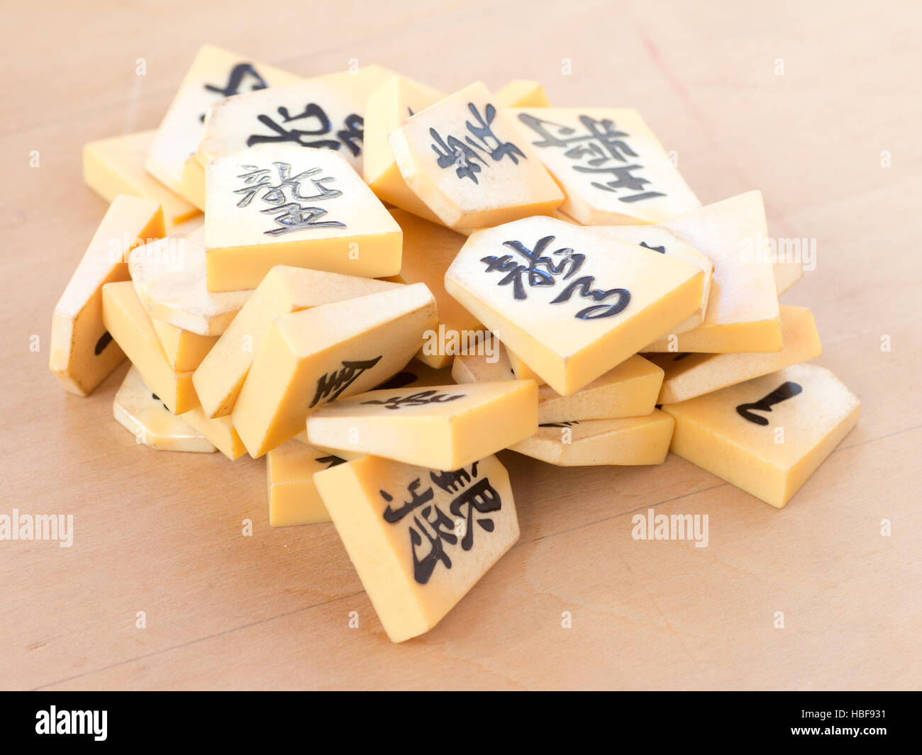 A pile of the Japanese chess pieces called Shogi, also known as a starting postion on a game called Shogi Kuzushi Stock Photo