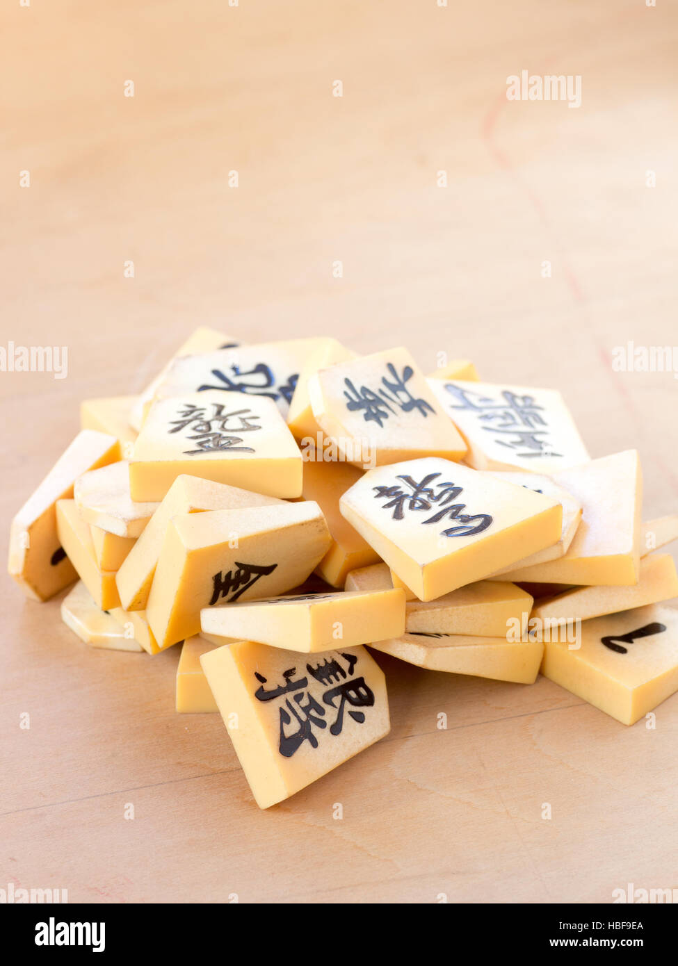 A pile of the Japanese chess pieces called Shogi, also known as a starting postion on a game called Shogi Kuzushi Stock Photo