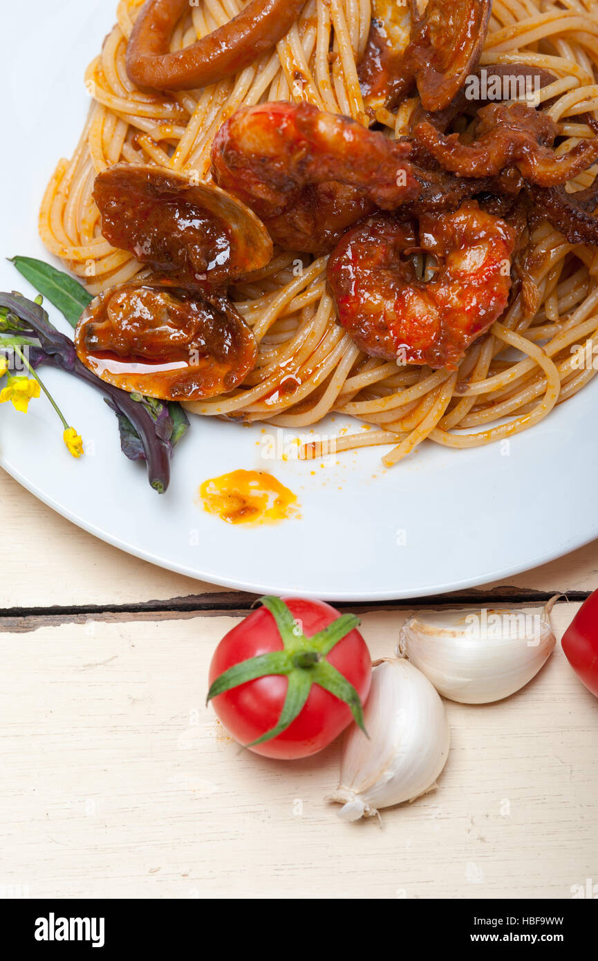Italian seafood spaghetti pasta on red tomato sauce Stock Photo - Alamy