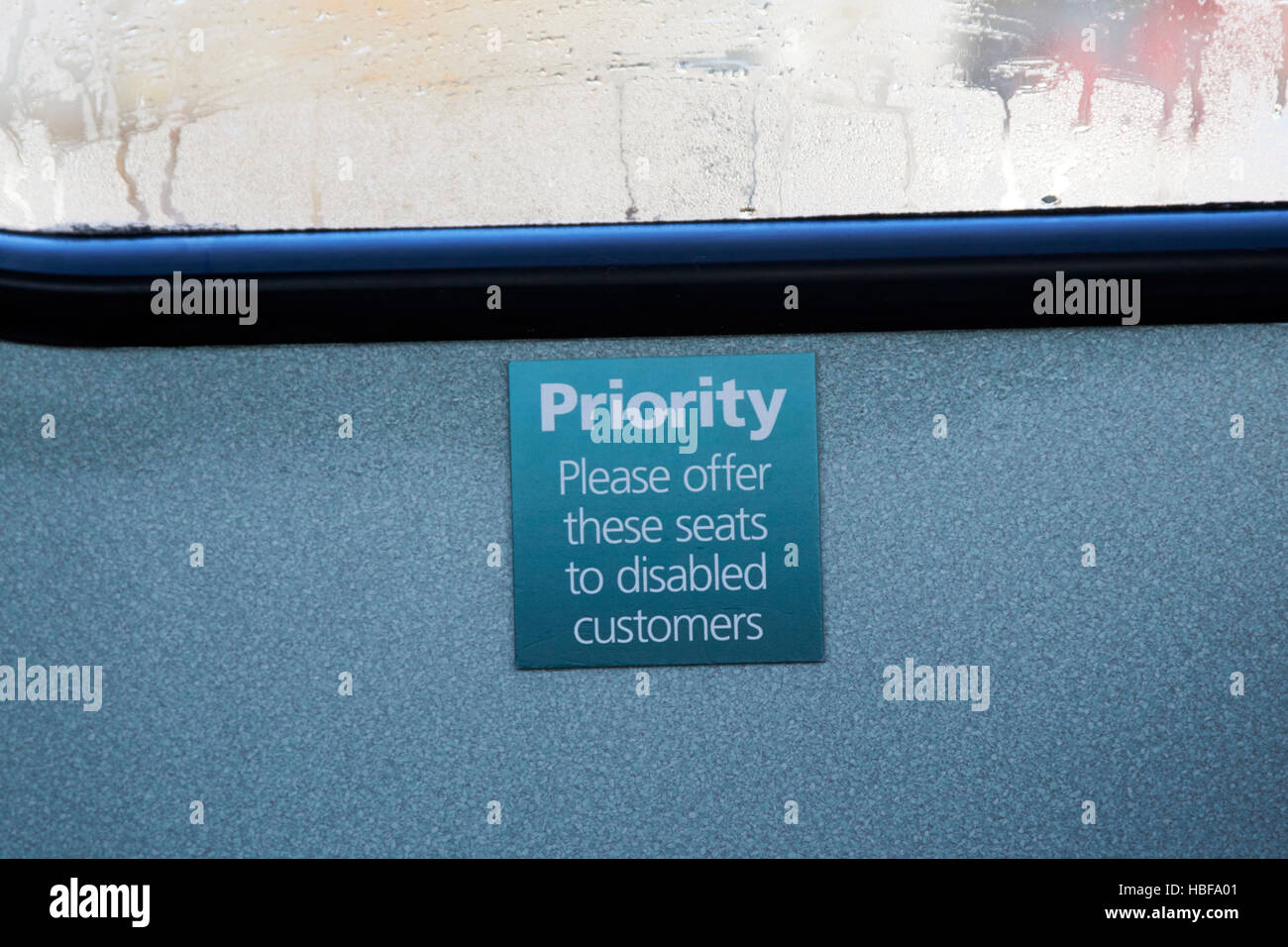 sign for priority seats on a bus for disabled customers in the uk Stock Photo