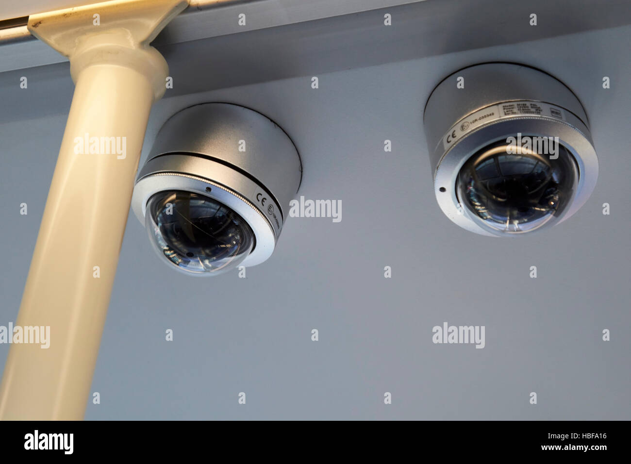 cctv cameras on the interior ceiling of a bus in the uk Stock Photo