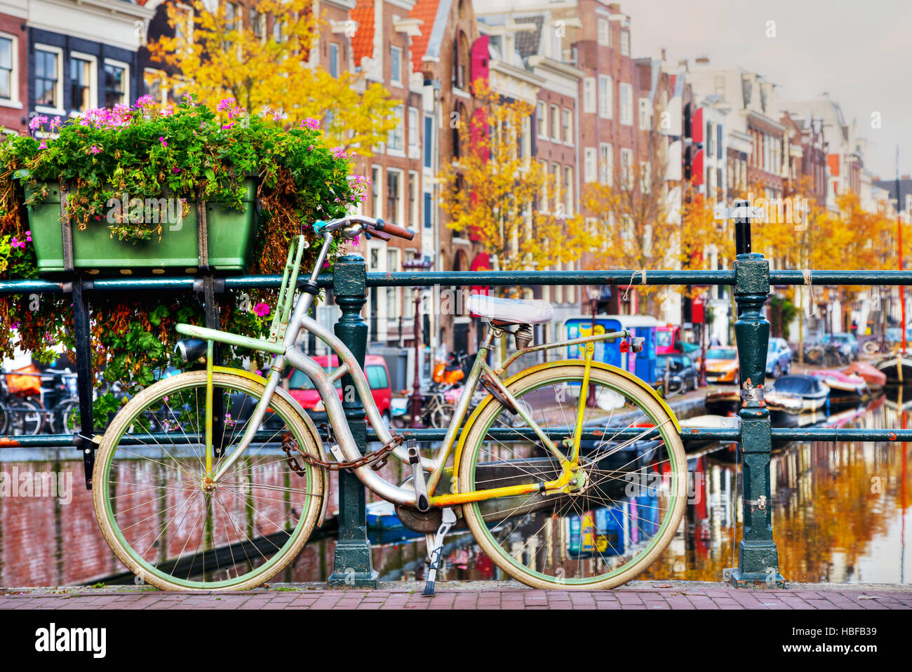 Bycicle parked at the bridge in Amsterdam Stock Photo