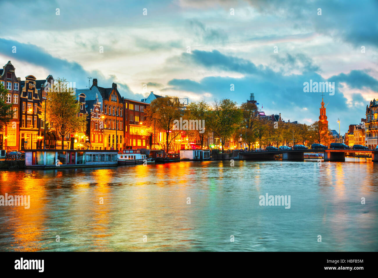 Amsterdam city view with Amstel river at sunset Stock Photo