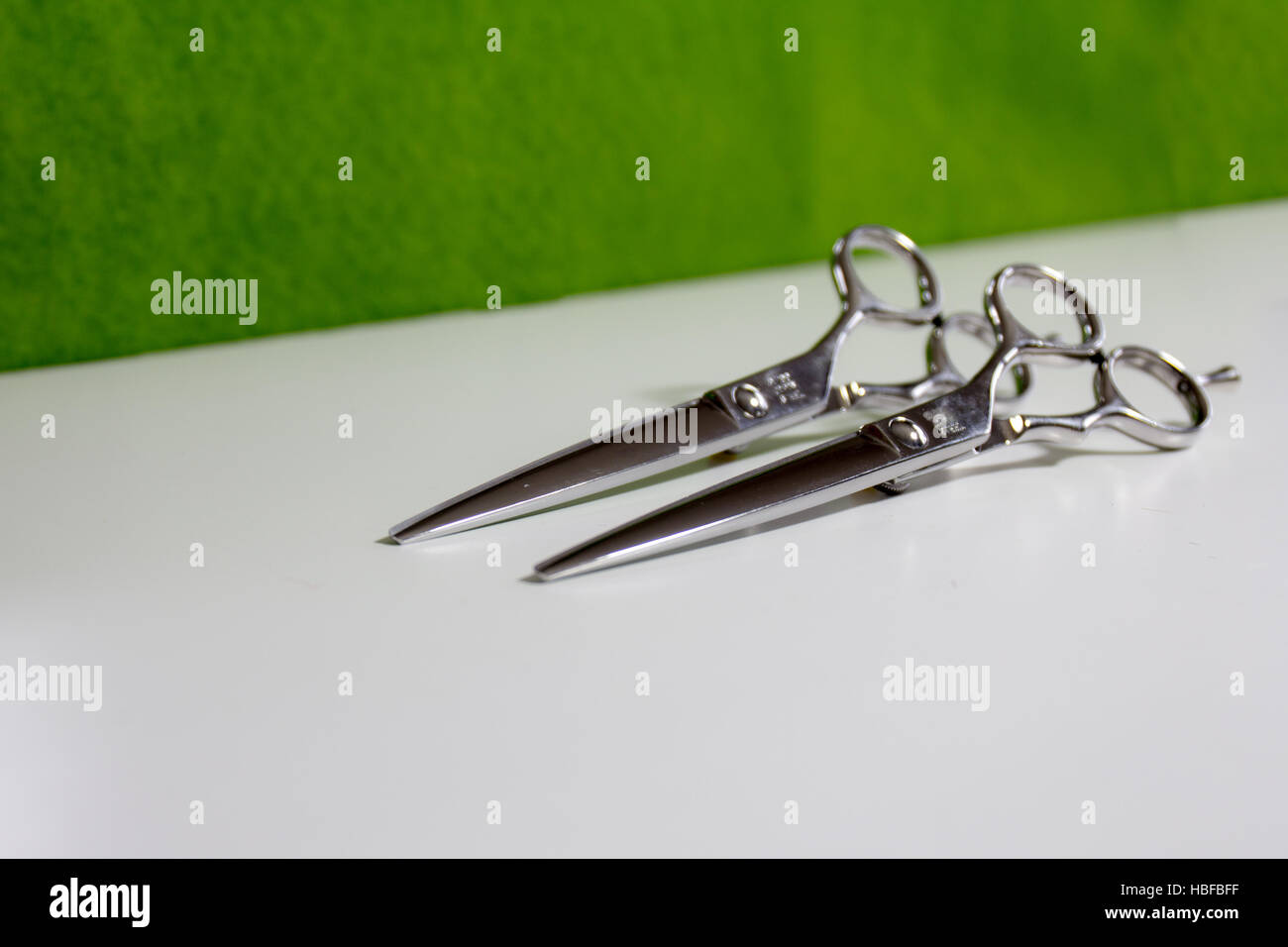 Two silver scissors for cutting hair Stock Photo