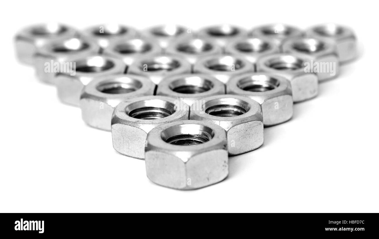 Layer of metal nuts Stock Photo