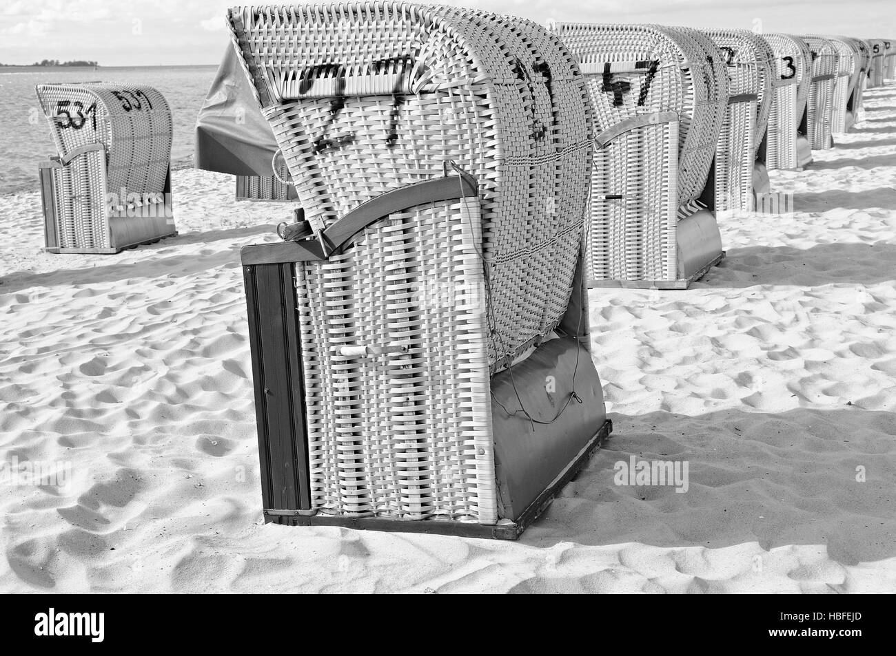 Beach chairs in row black and white Stock Photo