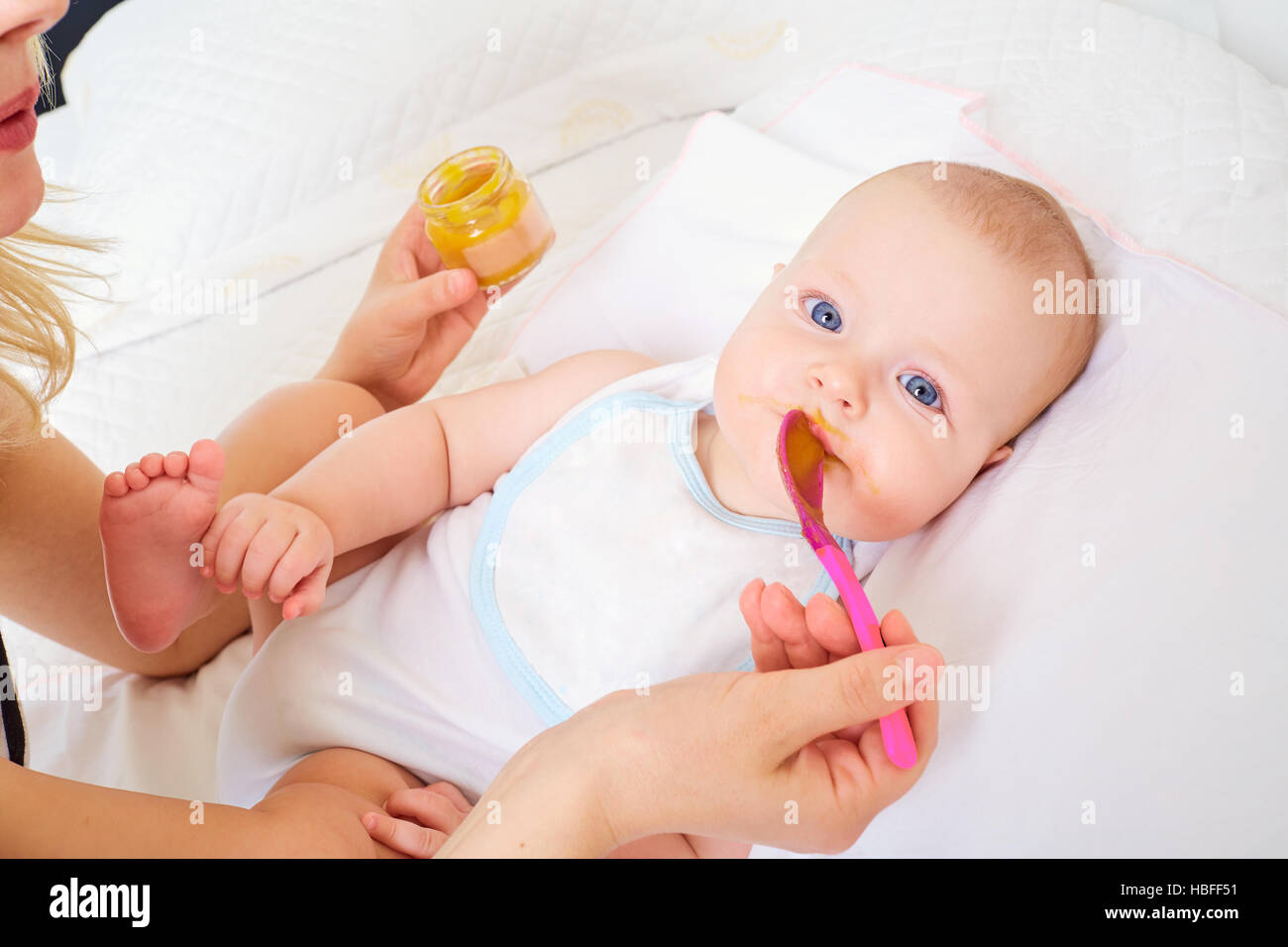 Child Feeding. Mother baby food from Stock Photo