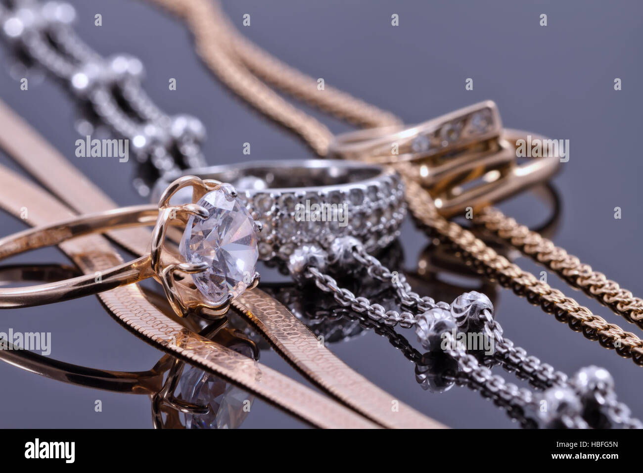 gold ring, earrings and chains Stock Photo