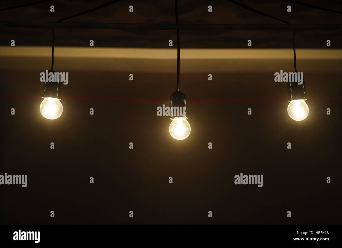 five included light bulbs in a dark room Stock Photo Alamy